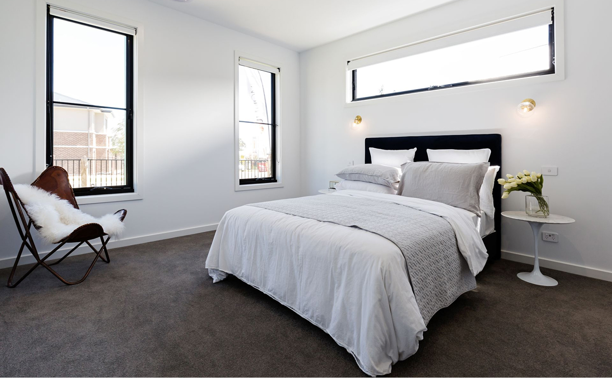 Bright upstairs bedroom with large windows